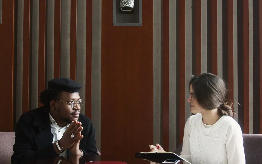 Two people in a focused, respectful business conversation