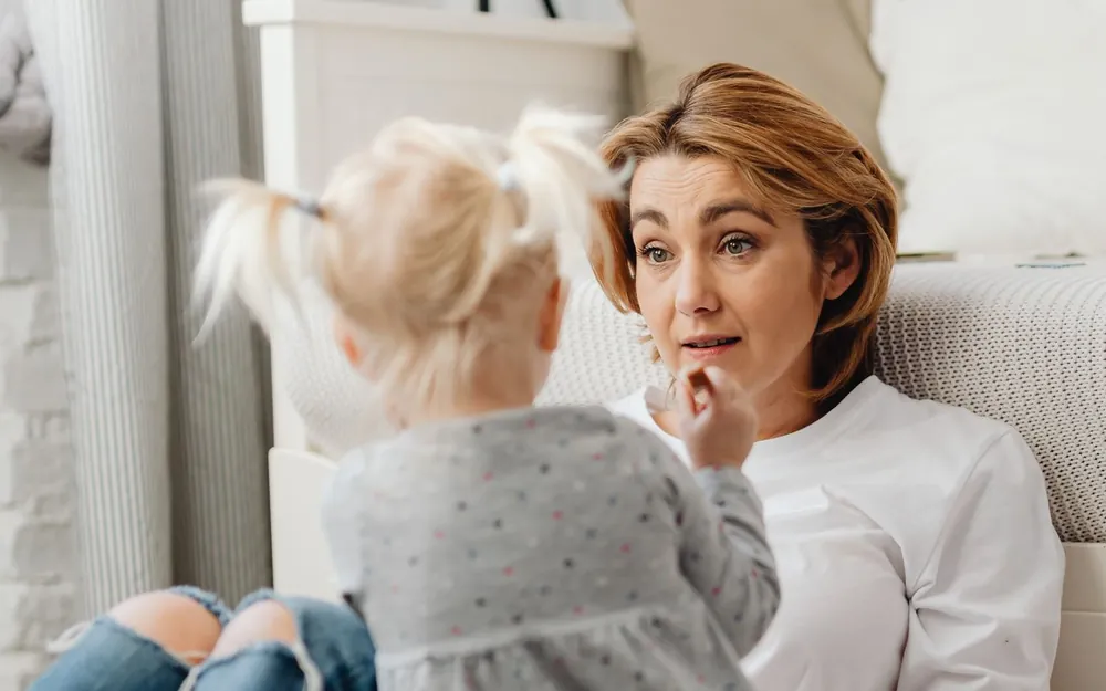A parent and child in a warm, calm moment at home